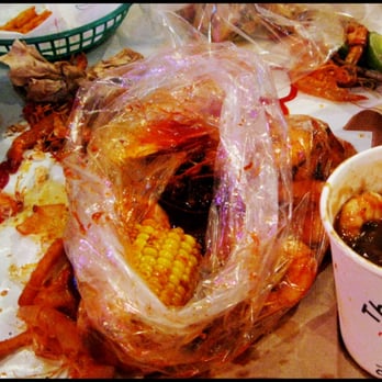 The Boiling Crab - My bag of grease with some shrimp and a piece of corn thrown in for looks. - Seafood Near Me - Alhambra, California The Boiling Crab - My bag of grease with some shrimp and a piece of corn thrown in for looks. - Seafood Near Me - Alhambra, California