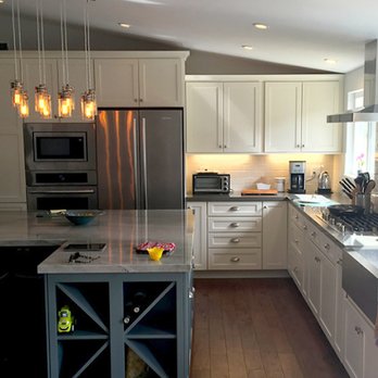 JK Wood Construction - a kitchen with white cabinets and stainless steel appliances - General Contractors Near Me - Goleta, California JK Wood Construction - a kitchen with white cabinets and stainless steel appliances - General Contractors Near Me - Goleta, California