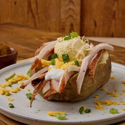 Bigham's Smokehouse - Stuffed Baker with Butter, Cheese, Sour Cream, Scallions, topped with our Signature Turkey Breast - Bigham's Smokehouse