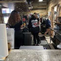 Coop DeVille - The workers are standing around doing nothing and the blonde in the back is rude and disrespectful.