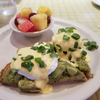 Daily Eats - Avocado toast with poached eggs and a side of fresh fruit. - New American Near Me - Tampa, Florida