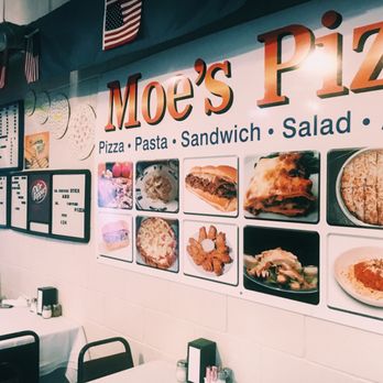 Moe's Pizza - a restaurant with a large menu on the wall - Pizza Near Me - Liberty City, Texas Moe's Pizza - a restaurant with a large menu on the wall - Pizza Near Me - Liberty City, Texas