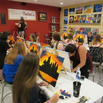 Painting with a Twist - Everyone is concentrating so hard.  This is in the separate classroom behind the main studio.  It was perfect! - Art Classes Near Me - Carmel, Indiana