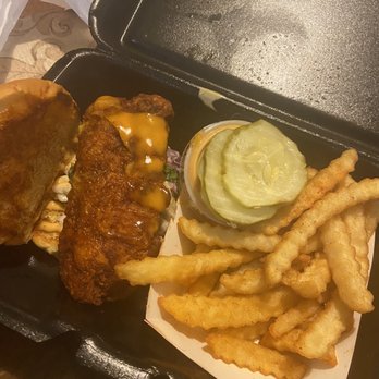 Dave's Hot Chicken - Second pickup: Dave's #4 1 Slider with Fries Heat level: Extra Hot  Opened up to show the true star of the meal (chicken) - Chicken Shop Near Me - Yuma, Arizona