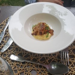 La Poudette - Starter of menu du marche; polenta with girlies and crispy pancetta with a beautiful egg yolk hidden under it.