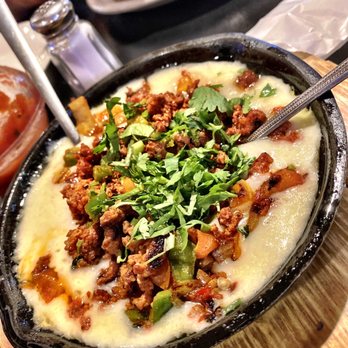 Restaurant Nuevo Leon - Queso flameado with chorizo. - Mexican Near Me - Fort Worth, Texas