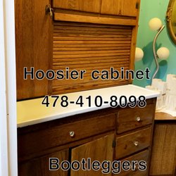 Bootleggers Antiques - Antique Hoosier cabinet with flour sifter, pull-up door, spice rack, a lot of space for small kitchen