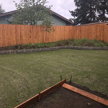 Fairway Hydroseed - a backyard with a wooden fence - Landscaping Near Me Fairway Hydroseed - a backyard with a wooden fence - Landscaping Near Me