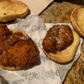 Carl's Jr - two fried chicken sandwiches on a piece of paper - Burgers Near Me - Newbury Park, California Carl's Jr - two fried chicken sandwiches on a piece of paper - Burgers Near Me - Newbury Park, California
