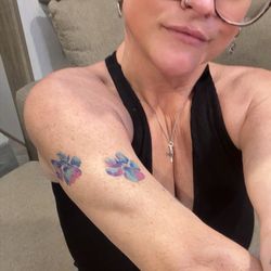 Legacy tattoo lounge - I got this tattoo from Heather from the paw prints of my recently departed dog of 13 years. She is very talented and has a very light hand.