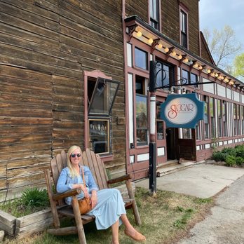 The Slogar Bar & Restaurant - a woman sitting on a bench - Southern Near Me - Crested Butte, Colorado