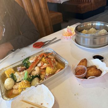 Crab Grabber - We had combo A, wings really juicy wings, onion rings that were  so good, and chicken steam dumplings . - Seafood Near Me - Pasadena, California