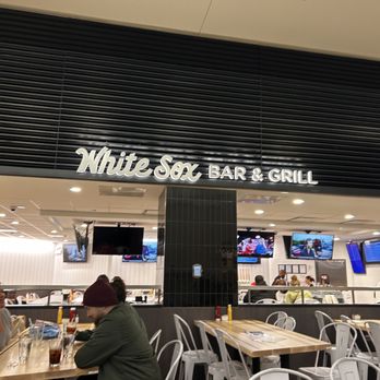 White Sox Grill - a man sitting at a table - Bars Near Me - Chicago, Illinois