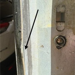Best Overhead Doors & Vinyl Siding - Bent track in multiple locations because they used claw hammer to pop out rollers quickly