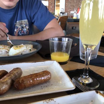 Canvas - Mimosa with oj - New American Near Me - Orlando, Florida Canvas - Mimosa with oj - New American Near Me - Orlando, Florida