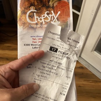 Chopstix - a hand holding a piece of paper - Chinese Near Me - Lake Mary, Florida