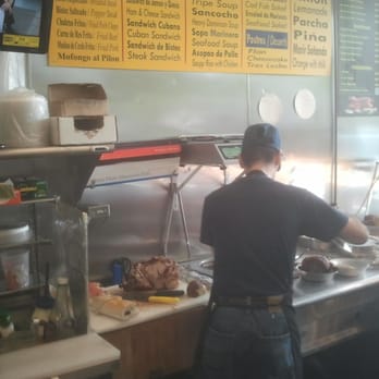 Lechonera El Sazon Criollo - Employee hard at work. - Puerto Rican Near Me - The Bronx, New York Lechonera El Sazon Criollo - Employee hard at work. - Puerto Rican Near Me - The Bronx, New York