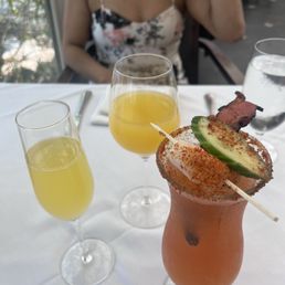 Her bottomless mimosa and my michelada.