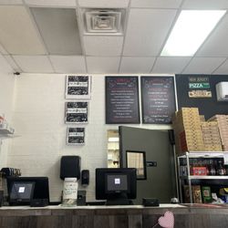 The Jersey Spot Pizza And Pasta - Counter area and specials board