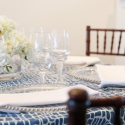 Buzz Worthy Events - Blue table elegantly laid out with a dark walnut chair.