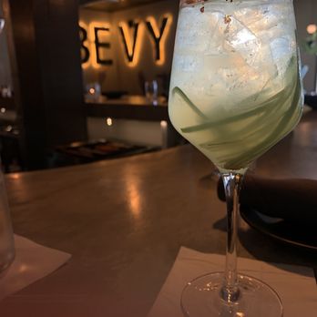 The Bevy Co - Cucumber Cartel: House jalapeño infused vodka, muddled cucumber, lime juice, bubbles, spicy honey. Pairs with Chicken Bao Bun - Cocktail Bars Near Me - Southbury, Connecticut The Bevy Co - Cucumber Cartel: House jalapeño infused vodka, muddled cucumber, lime juice, bubbles, spicy honey. Pairs with Chicken Bao Bun - Cocktail Bars Near Me - Southbury, Connecticut
