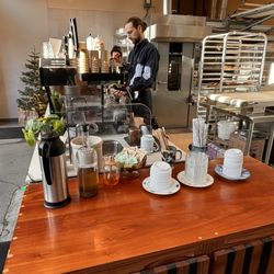 Moulin - The creamer/sugar station at the pick up zone for coffee and food items
