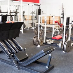 Phenomenal Fitness - Strength training are which includes power racks, Bench press platform, leg press machine, and other accessory machines.