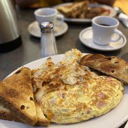 Huge portions! The Denver omelette with hash browns and raisin toast.