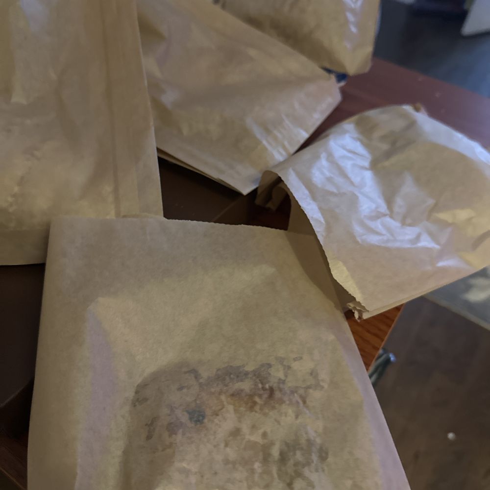 Paper stuck hard on pastry (plus other smushed pastries in the back)