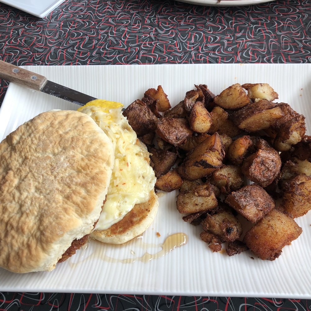 Triangle Diner - Fried chicken, pepper jack cheese, egg on a buttermilk biscuit with honey and home fries - Diners Near Me - Saratoga Springs, New York Triangle Diner - Fried chicken, pepper jack cheese, egg on a buttermilk biscuit with honey and home fries - Diners Near Me - Saratoga Springs, New York
