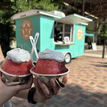 Hokulani Shave Ice - a woman holding two ice cream cones - Shaved Ice Near Me - San Antonio, Texas