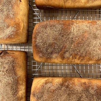 H Wyatt - four loafs of bread on a cooling rack - Bakeries Near Me - Bishop Hill, Illinois H Wyatt - four loafs of bread on a cooling rack - Bakeries Near Me - Bishop Hill, Illinois