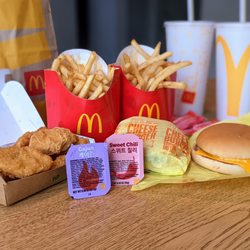 McDonald's - The BTS Meal ($6.89) and Two Cheese Burger Meal ($5.19). $12.99 total after tax. Portrait mode pic.