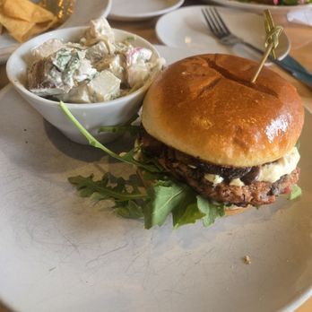 Reverie Cafe + Bar - Long Haul burger with potato salad - Vegan Near Me - Minneapolis, Minnesota Reverie Cafe + Bar - Long Haul burger with potato salad - Vegan Near Me - Minneapolis, Minnesota
