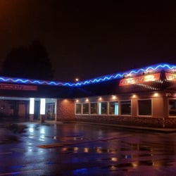 Jimmy J's Grill - Storefront at night.