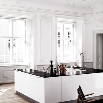 Manhattan Hardwood Floors - a white kitchen with black countertops - Flooring Near Me Manhattan Hardwood Floors - a white kitchen with black countertops - Flooring Near Me