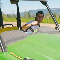 Good Buds - Our Facility Manger Mikey doing a run on the gator to inspect our organic marijuana crop.