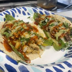 The Real Taco - Real taco:choice of meat,cilantro,onions,rousted Anaheim peppers,mozzarella cheese and salsa