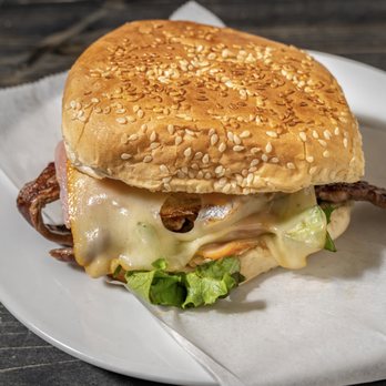 Lomito’s Spot - a sandwich with meat, cheese and lettuce - Food Trucks Near Me - Queens, New York