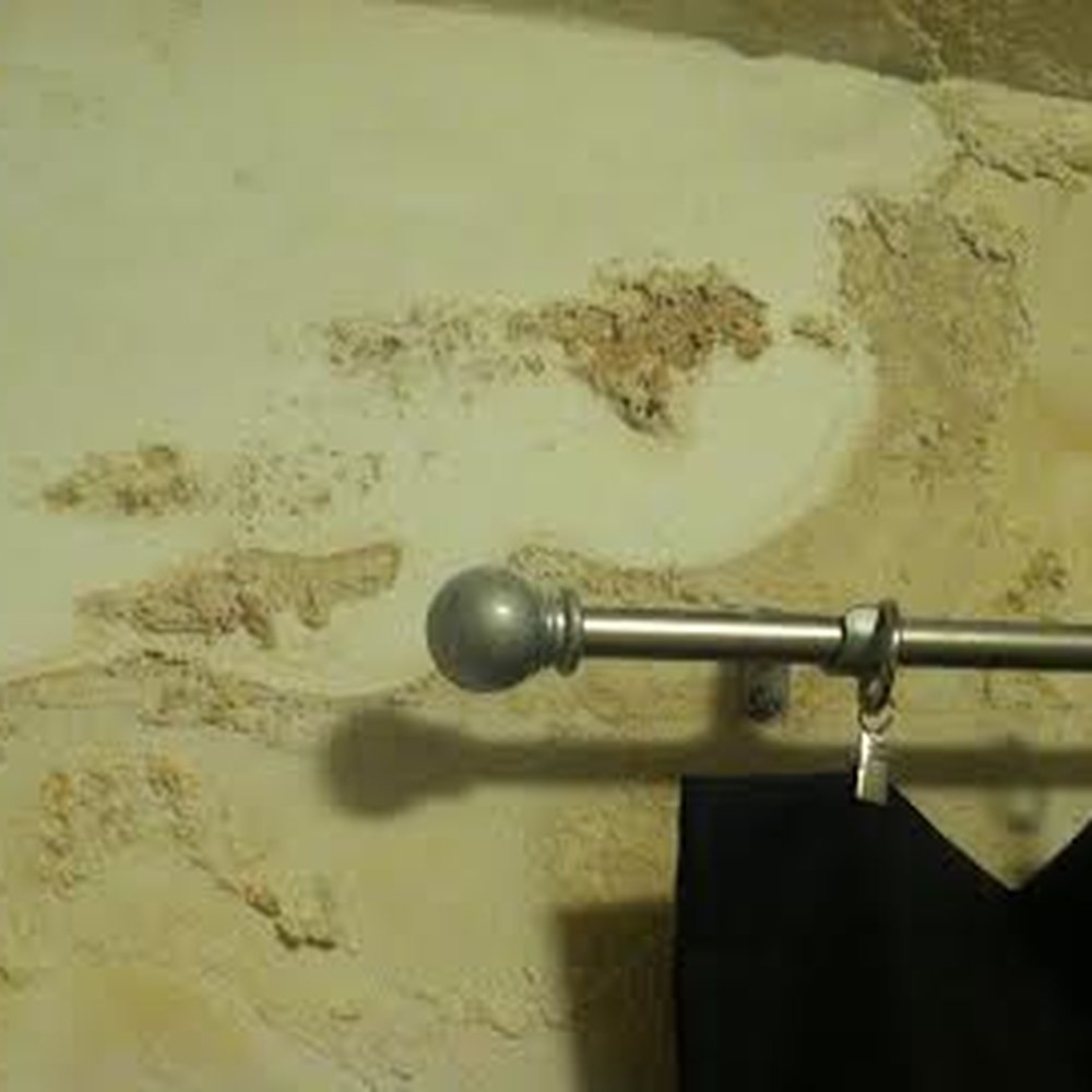 Water damage in our bedroom. The drywall eventually rotted and our curtain rod just fell out. Water damage in our bedroom. The drywall eventually rotted and our curtain rod just fell out.