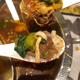 Beef and veggies with their rice Beef and veggies with their rice