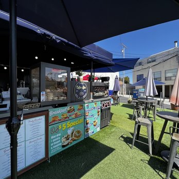 Cafe Bella - outdoor seating area with tables and umbrellas - Coffee & Tea Near Me - San Diego, California Cafe Bella - outdoor seating area with tables and umbrellas - Coffee & Tea Near Me - San Diego, California