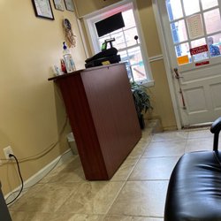 Arzum BarberShop - Waiting area. Comfortable chairs and a TV.