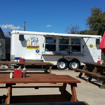The Pit BBQ - Seating is plentiful, sauce on table - Food Trucks Near Me - San Angelo, Texas