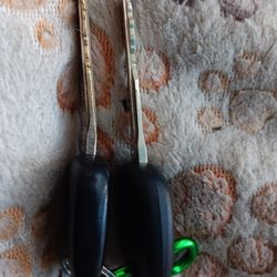 Bent key on the left next to new duplicate