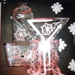 Faustina's Creole and Soul Food - Martini glass ICE Sculpture with a bottle of liquor behind it