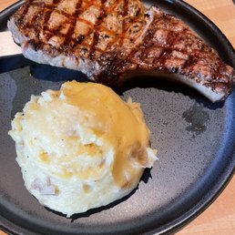 Bone-In Center Cut Pork Chop with mashed potatoes. Bone-In Center Cut Pork Chop with mashed potatoes.