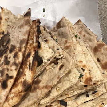 Maharaja Indian Cuisine - a stack of flatbreads - Indian Near Me - Omaha, Nebraska Maharaja Indian Cuisine - a stack of flatbreads - Indian Near Me - Omaha, Nebraska