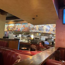 Skipolini's - Hard working on your delicious food in the kitchen!