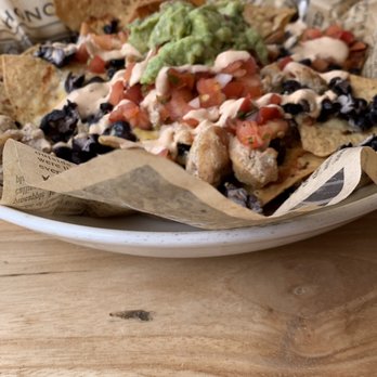 Duke's La Jolla - Black Bean Nachos with Chicken - New American Near Me - La Jolla, California Duke's La Jolla - Black Bean Nachos with Chicken - New American Near Me - La Jolla, California